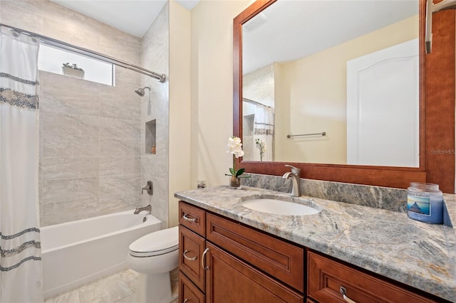 full bathroom featuring tile patterned floors, vanity, toilet, and shower / tub combo