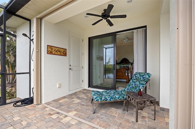 exterior space with ceiling fan