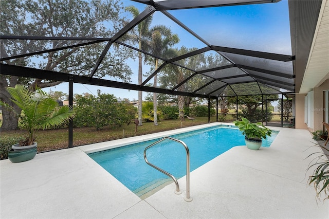 view of pool featuring a patio and glass enclosure