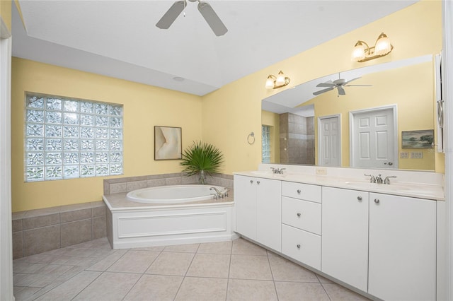 bathroom with vanity, a bathing tub, ceiling fan, and tile patterned flooring