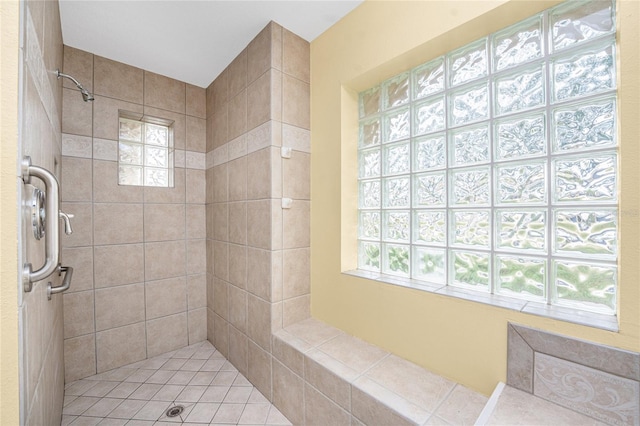 bathroom featuring a tile shower