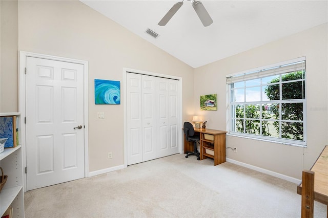 carpeted bedroom featuring a closet, vaulted ceiling, and ceiling fan