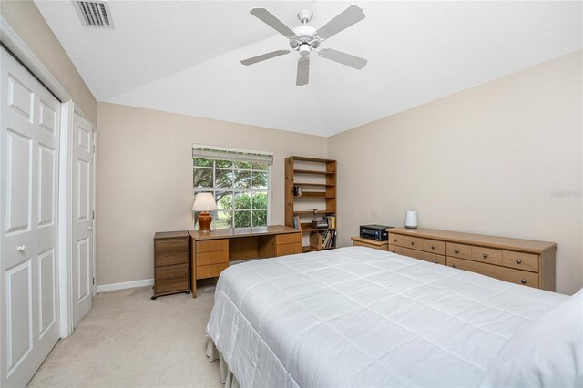 carpeted bedroom featuring lofted ceiling and ceiling fan