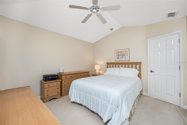 bedroom featuring ceiling fan, light colored carpet, and vaulted ceiling