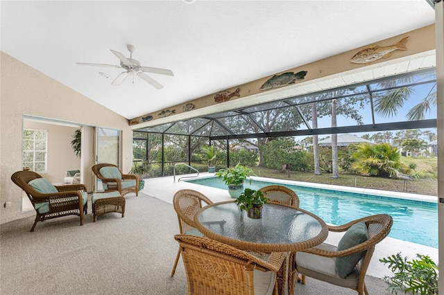 sunroom / solarium with vaulted ceiling, a pool, and ceiling fan