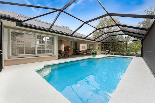 view of pool featuring a patio area, a lanai, and an outdoor hangout area