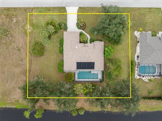 birds eye view of property with a water view