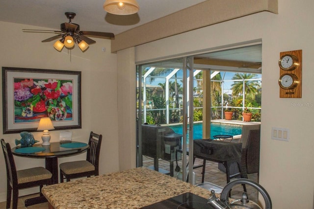 dining area with sink and ceiling fan