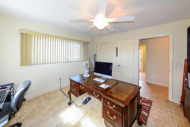 home office with light tile patterned floors and ceiling fan