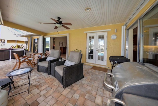 view of patio / terrace with an outdoor hangout area, ceiling fan, and french doors