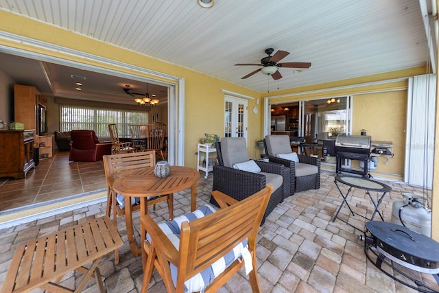 view of patio with outdoor lounge area, a grill, ceiling fan, and french doors