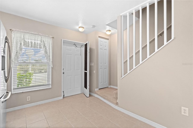 foyer with light tile patterned floors