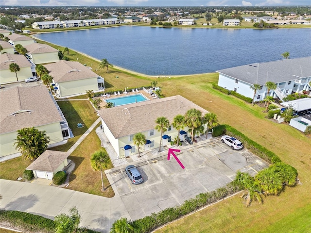 birds eye view of property featuring a water view