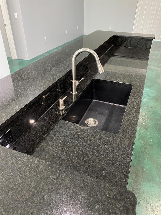 details with dark stone counters and sink