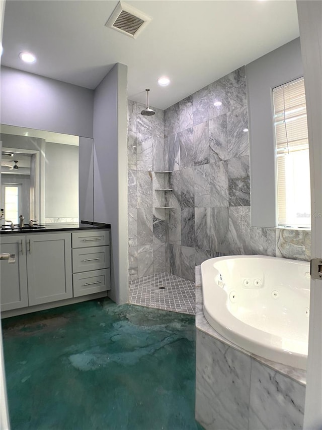 bathroom with vanity and independent shower and bath