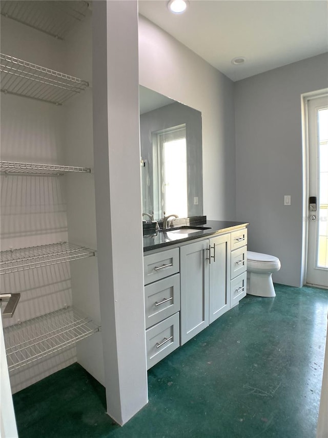 bathroom with vanity and toilet