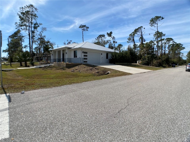 view of front of home with a garage and a front yard