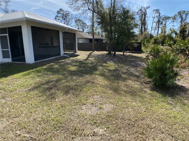 view of yard with a sunroom