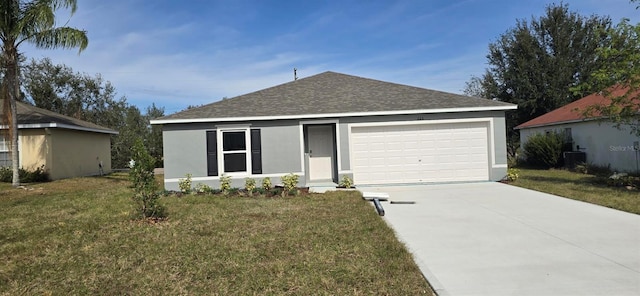 ranch-style house featuring a front lawn and a garage