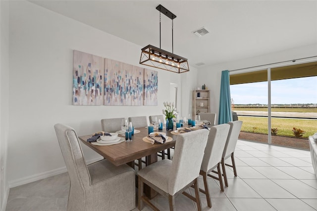 dining area with light tile patterned floors