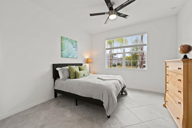 tiled bedroom with ceiling fan