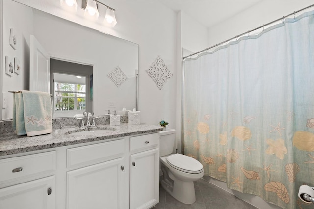 bathroom with toilet, vanity, tile patterned floors, and a shower with shower curtain