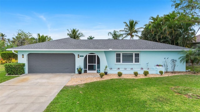 ranch-style house with a garage and a front yard