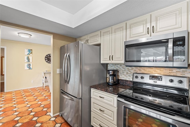 kitchen featuring stainless steel appliances and decorative backsplash