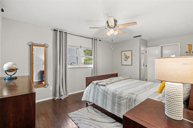 bedroom with ceiling fan and dark hardwood / wood-style flooring