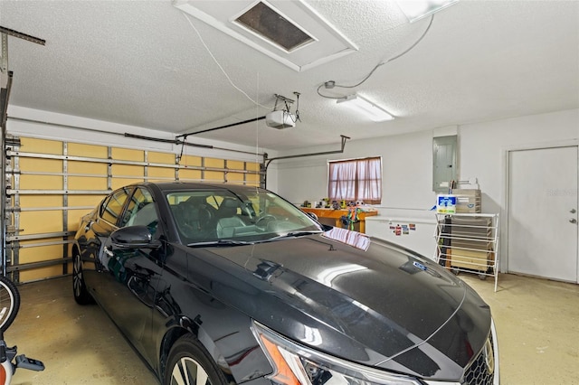 garage featuring electric panel and a garage door opener