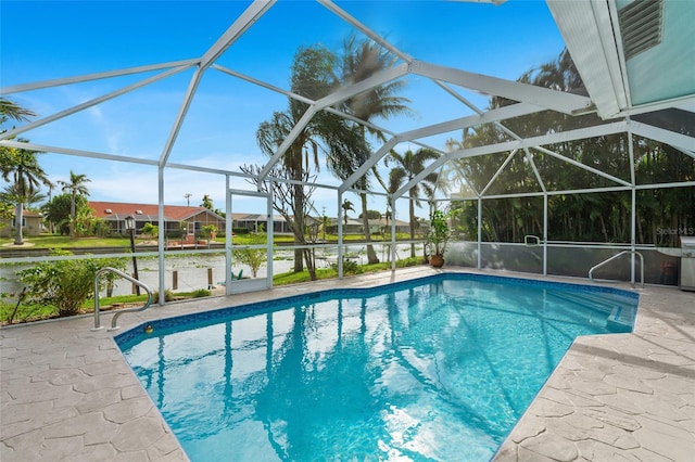 view of swimming pool with glass enclosure, a water view, and a patio