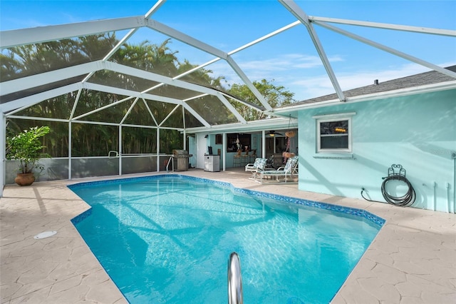 view of pool featuring a lanai and a patio area