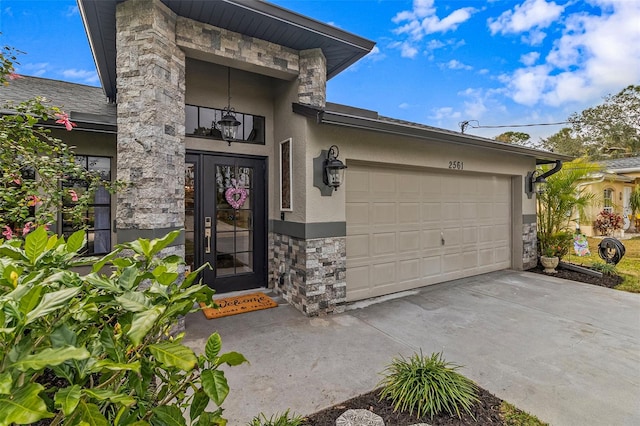 view of exterior entry with a garage