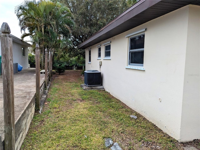 view of yard with central AC unit