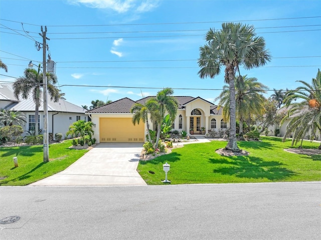 view of front of house with a front lawn and a garage