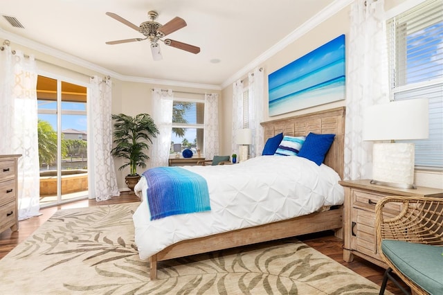 bedroom with access to outside, ceiling fan, ornamental molding, and multiple windows