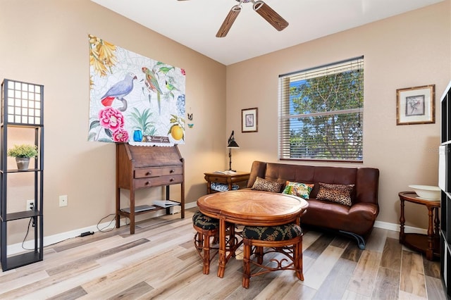 sitting room with ceiling fan and light hardwood / wood-style floors