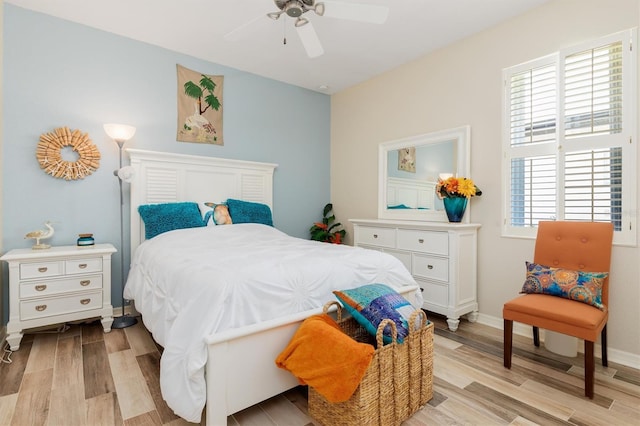 bedroom featuring ceiling fan and light wood-type flooring