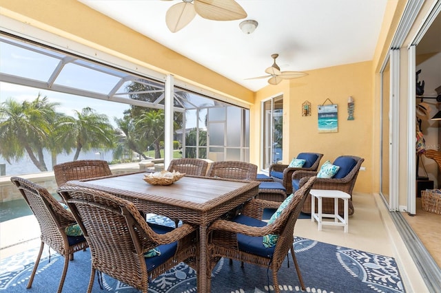 sunroom featuring ceiling fan