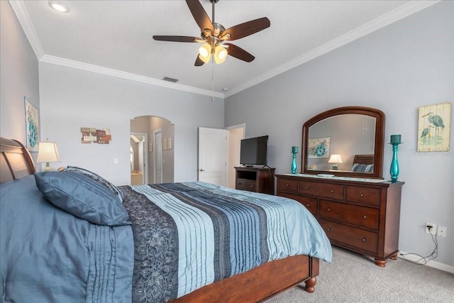 carpeted bedroom with ceiling fan and crown molding