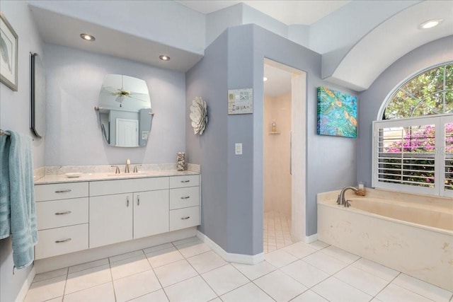 bathroom featuring ceiling fan, vanity, tile patterned flooring, and separate shower and tub