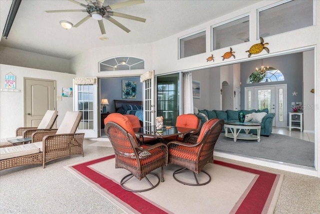 sunroom featuring ceiling fan and french doors