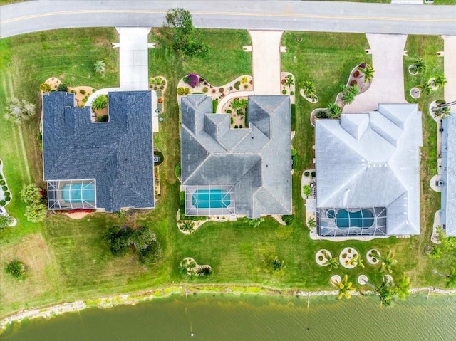 birds eye view of property featuring a water view