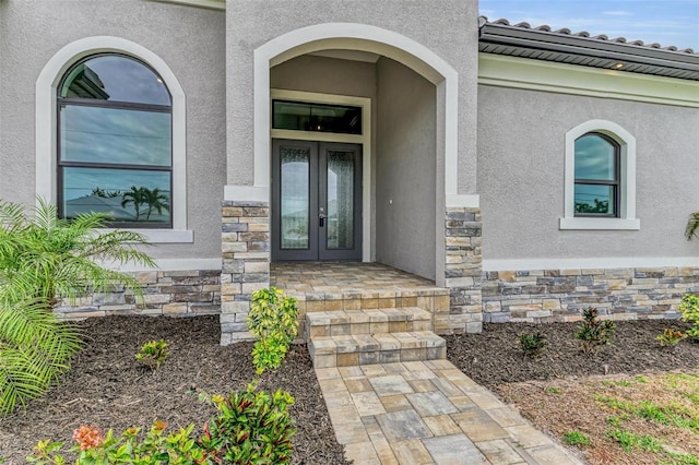 entrance to property featuring french doors