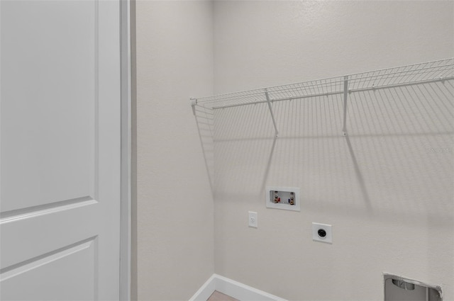 clothes washing area featuring electric dryer hookup and washer hookup