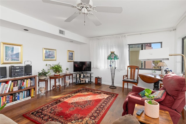 living room featuring ceiling fan, a wealth of natural light, and hardwood / wood-style floors