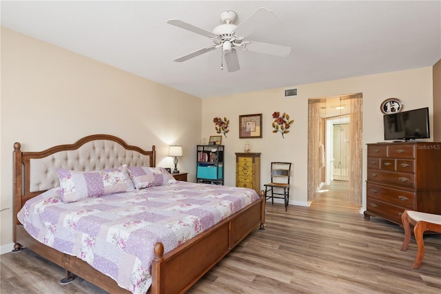 bedroom featuring ceiling fan and light hardwood / wood-style floors