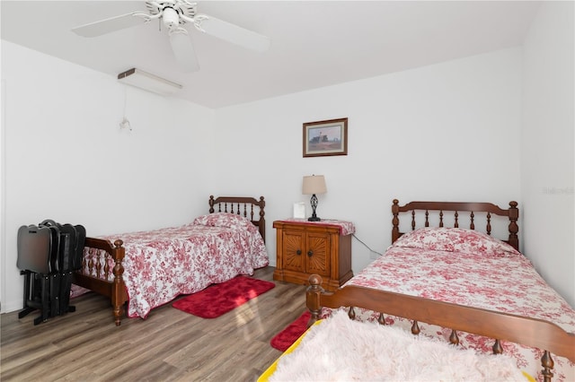 bedroom featuring ceiling fan and hardwood / wood-style flooring