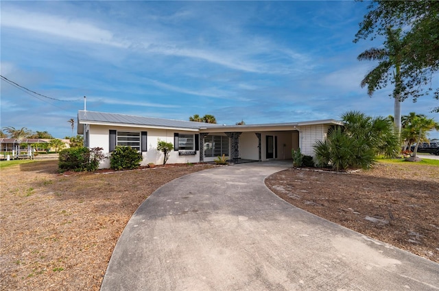 ranch-style house with a carport