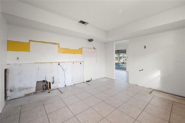 empty room with light tile patterned floors